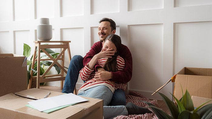 Young couple moving into a new home.